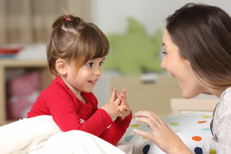 Young child and mother looking each other